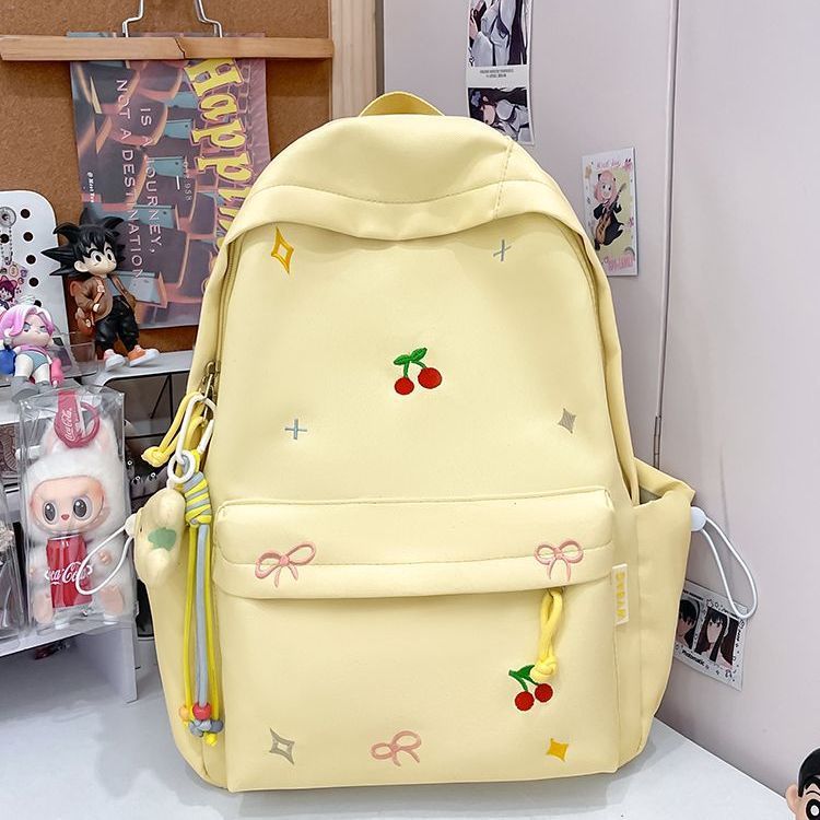 Playful backpack with embroidery Bowlift