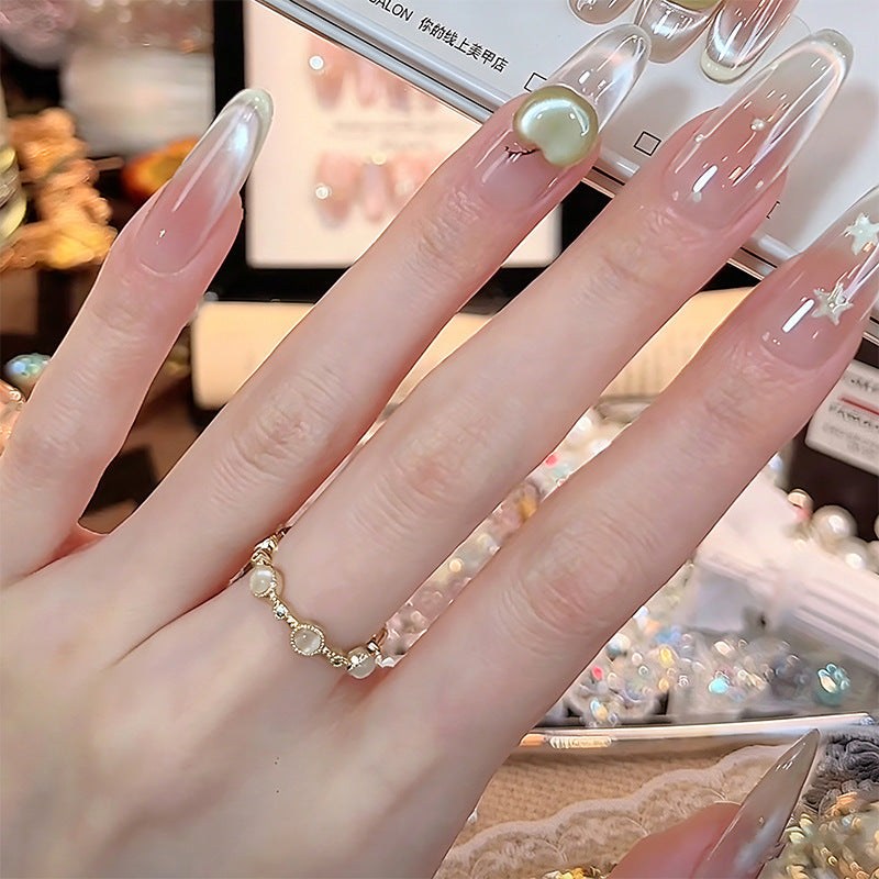 Artificial nail set with sparkling glitter accents Bowlift