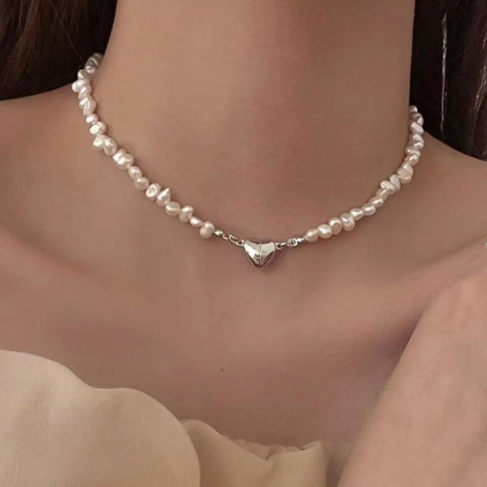 Elegant silver pearl bracelet with heart details Bowlift