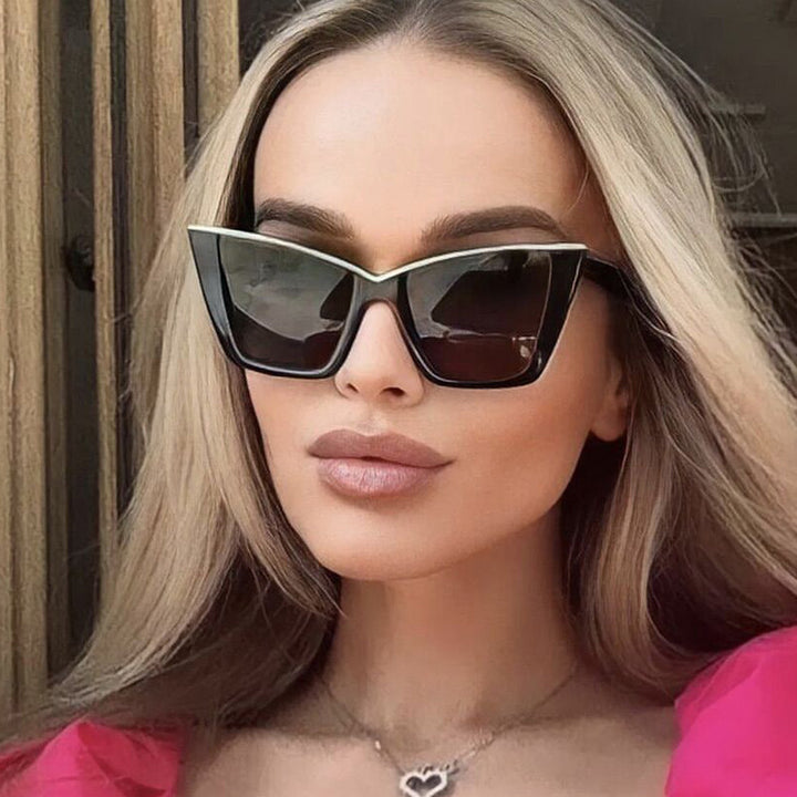 Women extravagant sunglasses with unique design and golden accents Bowlift