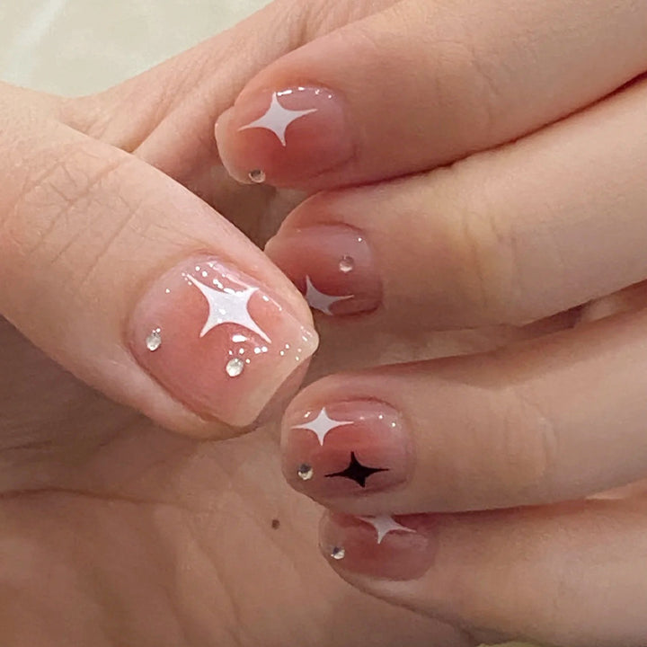 Acrylic nail set with sparkling star decorations and elegant accents Bowlift