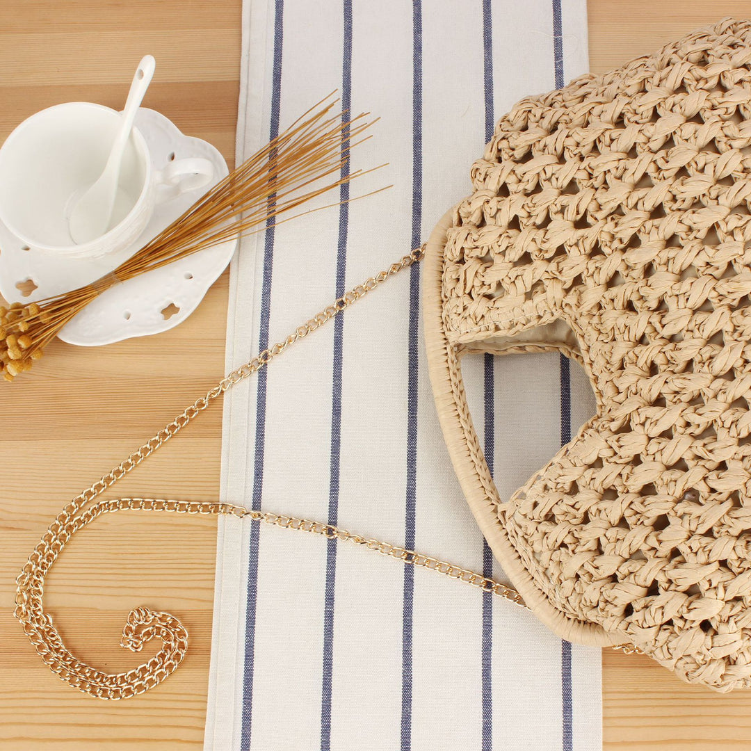 Handbag made of naturally untreated woven material with elegant chain embellishment Bowlift