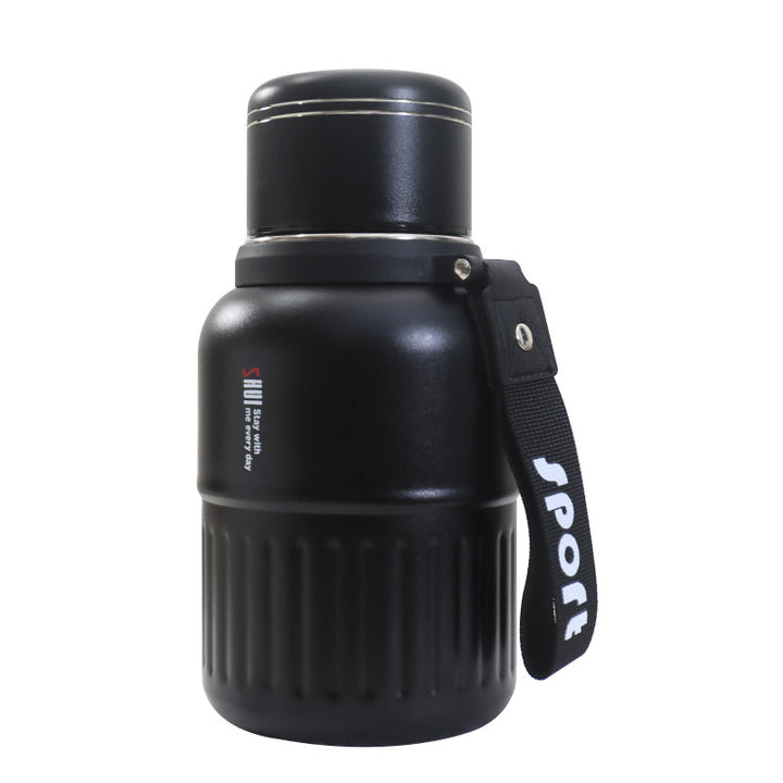 Insulated drinking bottle with integrated carrying strap Bowlift