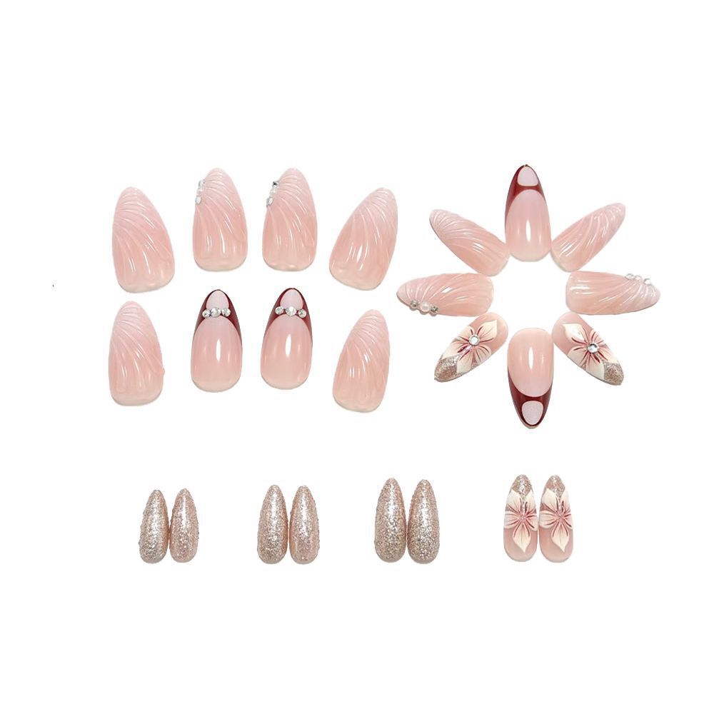 Artificial nails in elegant floral design with glitter accents Bowlift