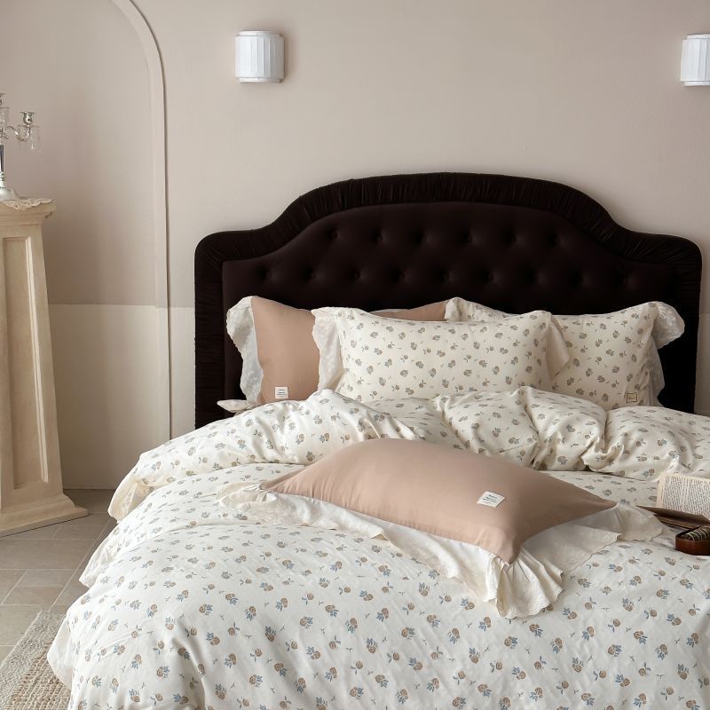 Luxurious cotton satin bed linen set in vintage style with delicate floral pattern and lace trim