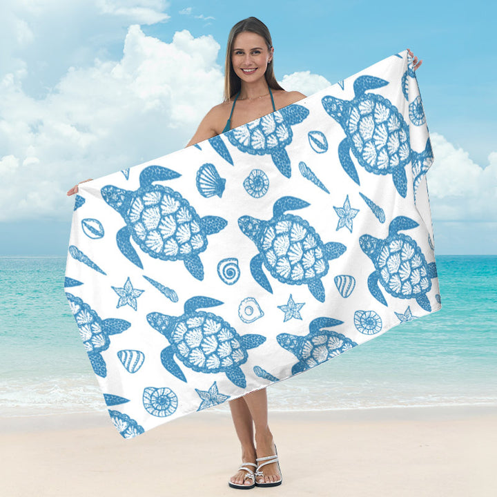 Beach blanket with tropical leaf design Bowlift
