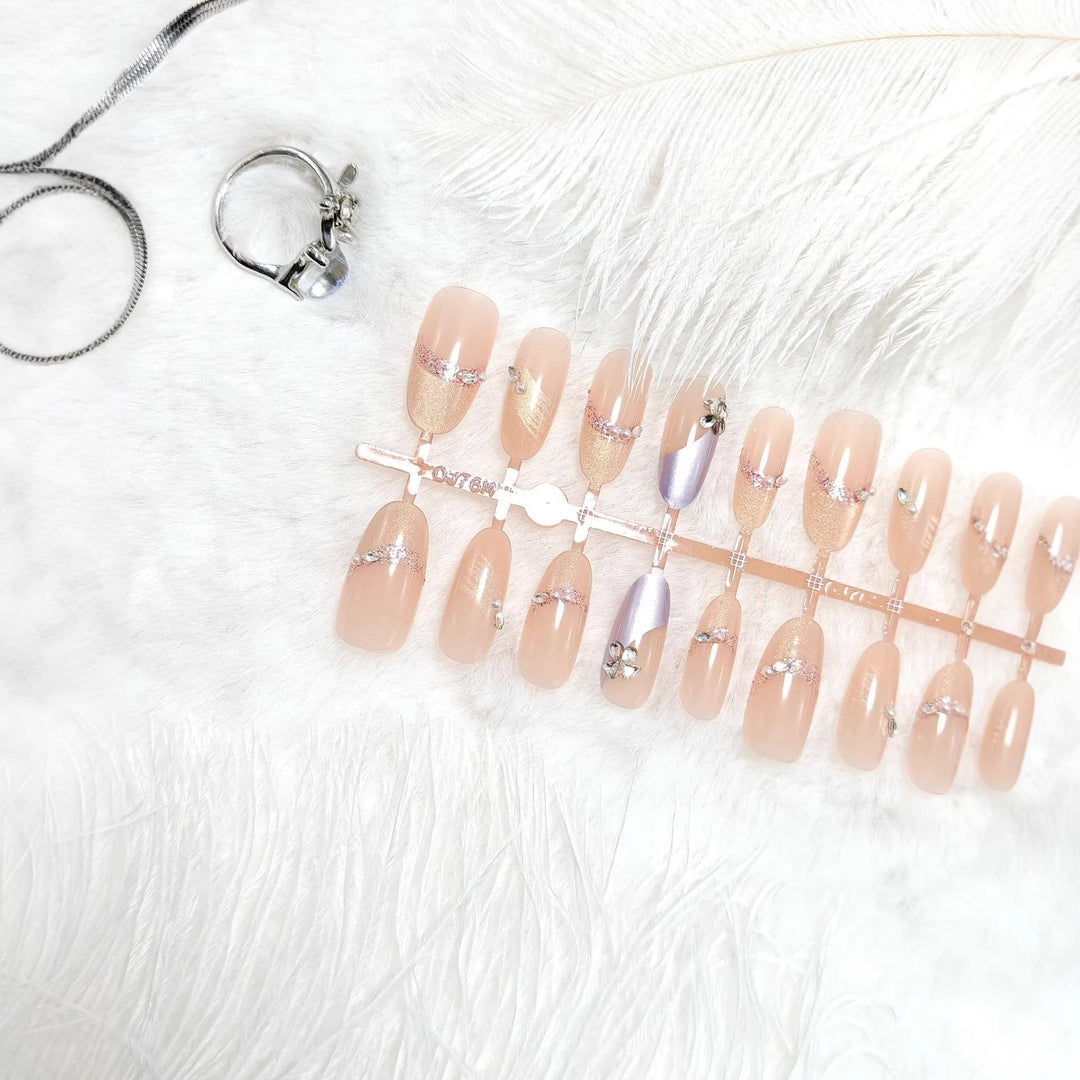 Artificial nails with modern glitter and stone embellishments Bowlift