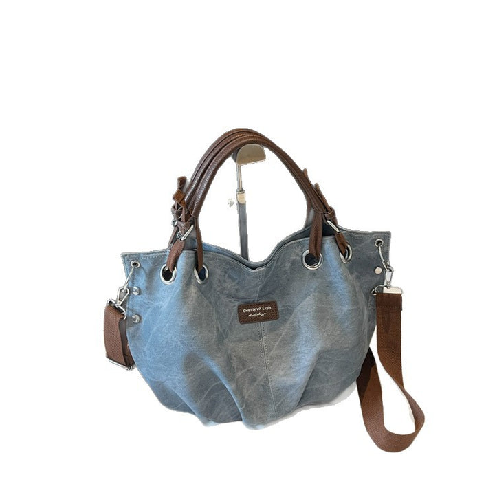 Everyday handbag with innovative carrying system Bowlift