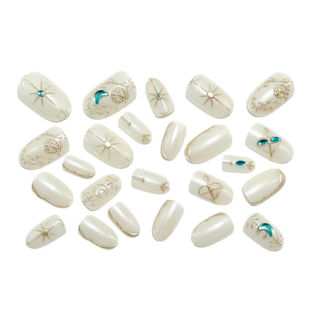 Artificial nails with elegant jewelry embellishments Bowlift