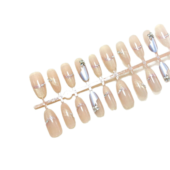 Artificial nails with modern glitter and stone embellishments Bowlift