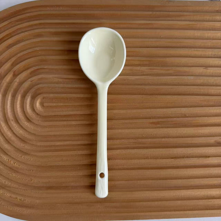 Ceramic soup spoon with lucky cat illustration and ergonomic long-handle Bowlift