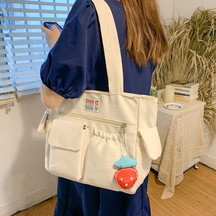 Tote bag with versatile compartments and ergonomic design Bowlift