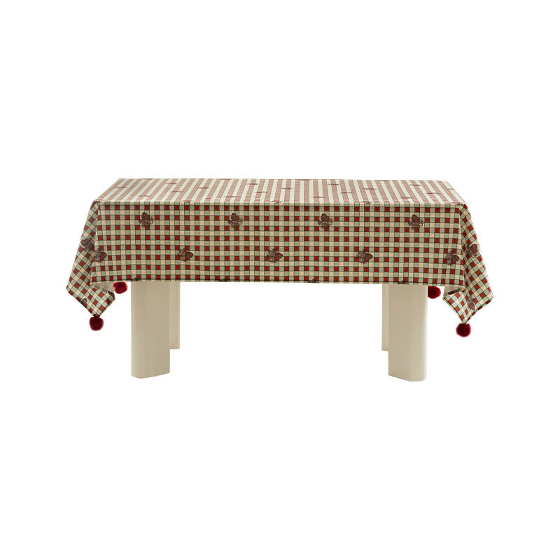 Rectangular decorative tablecloth with checkered pattern, pompom trim, and fine embroidered applique Bowlift