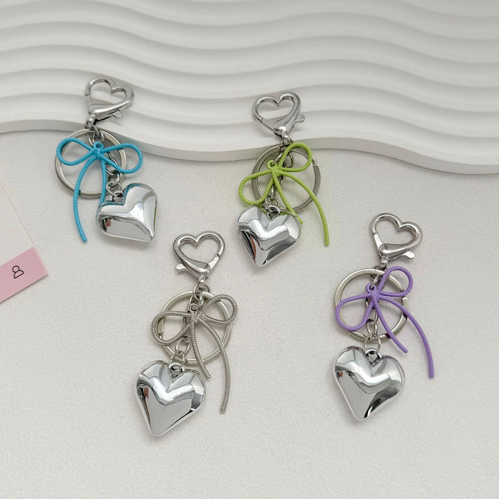 Heart-Shaped Metallic Keychain with Decorative Bow Bowlift