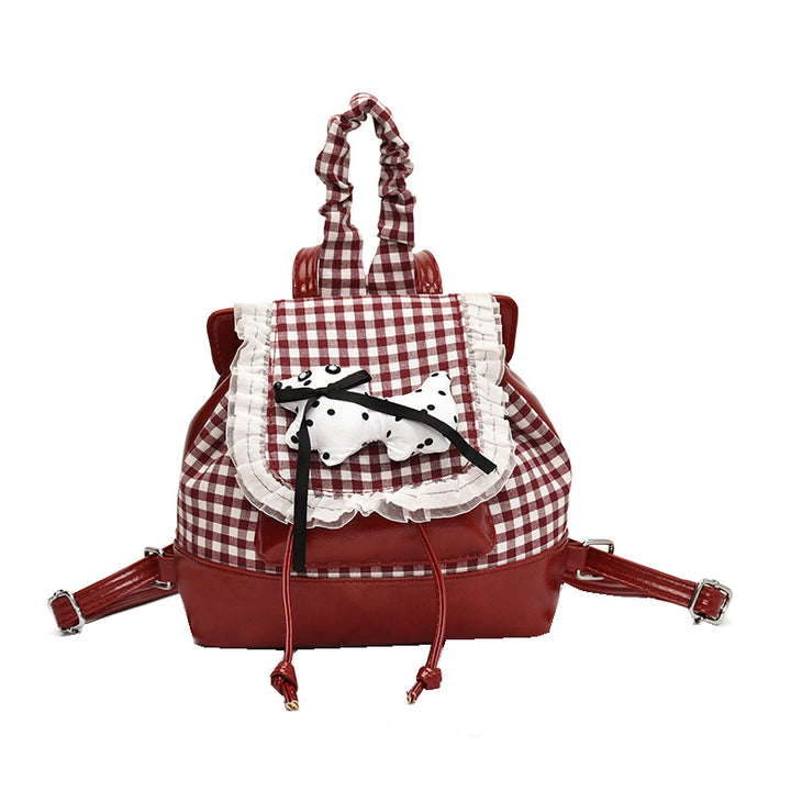 Playful backpack with checkered pattern and animal appliqué Bowlift