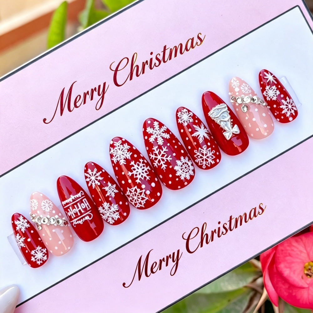 Artificial nails in festive Christmas design Bowlift