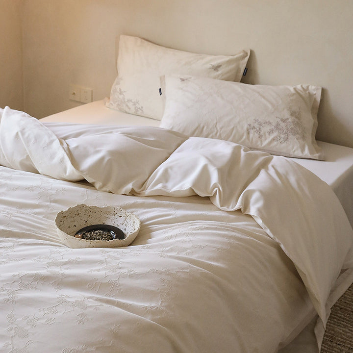 Exclusive cotton satin bedding set with tonal floral jacquard and fine decorative embroidery