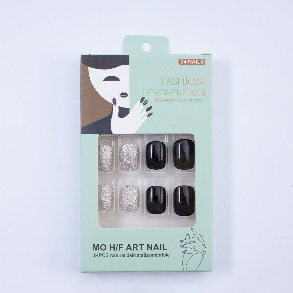 Artificial nails in elegant black with gloss and creative accents Bowlift
