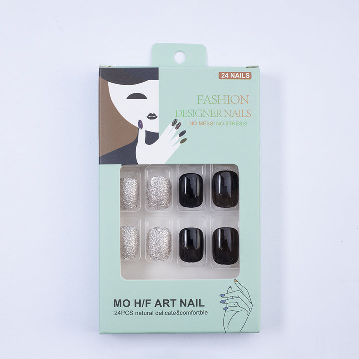 Artificial nails in elegant black with gloss and creative accents Bowlift