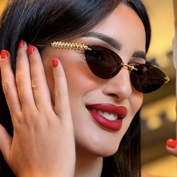 Women's sunglasses in modern, geometric design with stylish metal frame and UV protection Bowlift