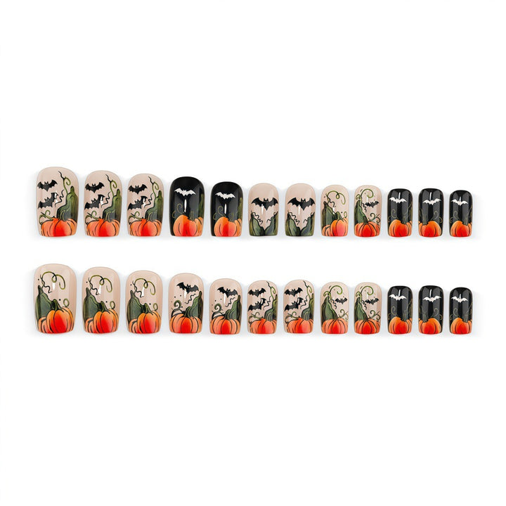 Artificial nails in Halloween design with pumpkins and ghosts Bowlift