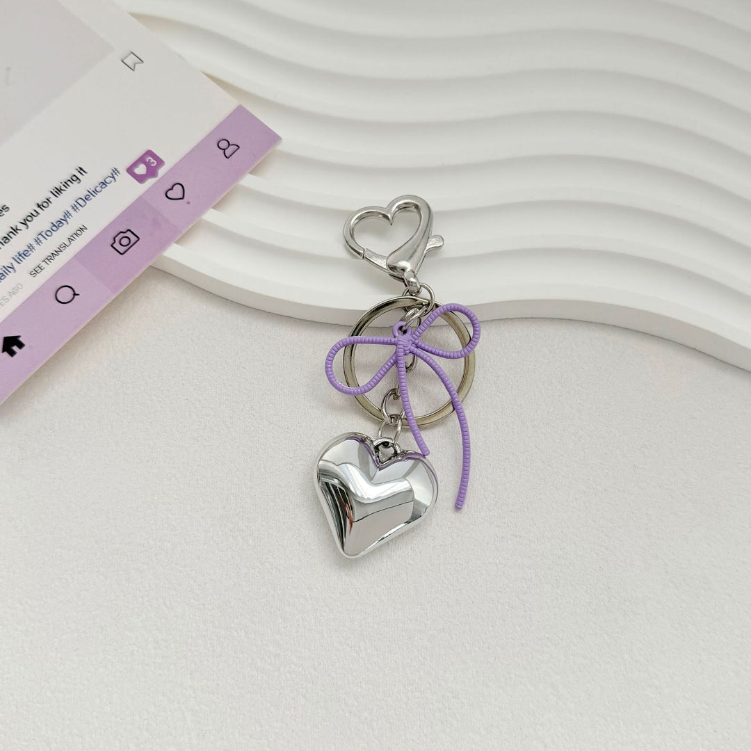 Heart-Shaped Metallic Keychain with Decorative Bow Bowlift