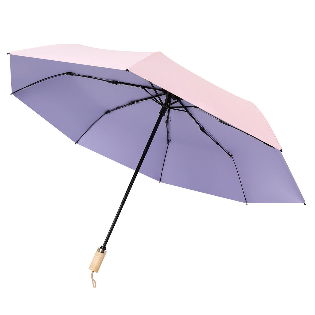Ladies elegant folding umbrella in portrait format with stylish wooden handle Bowlift