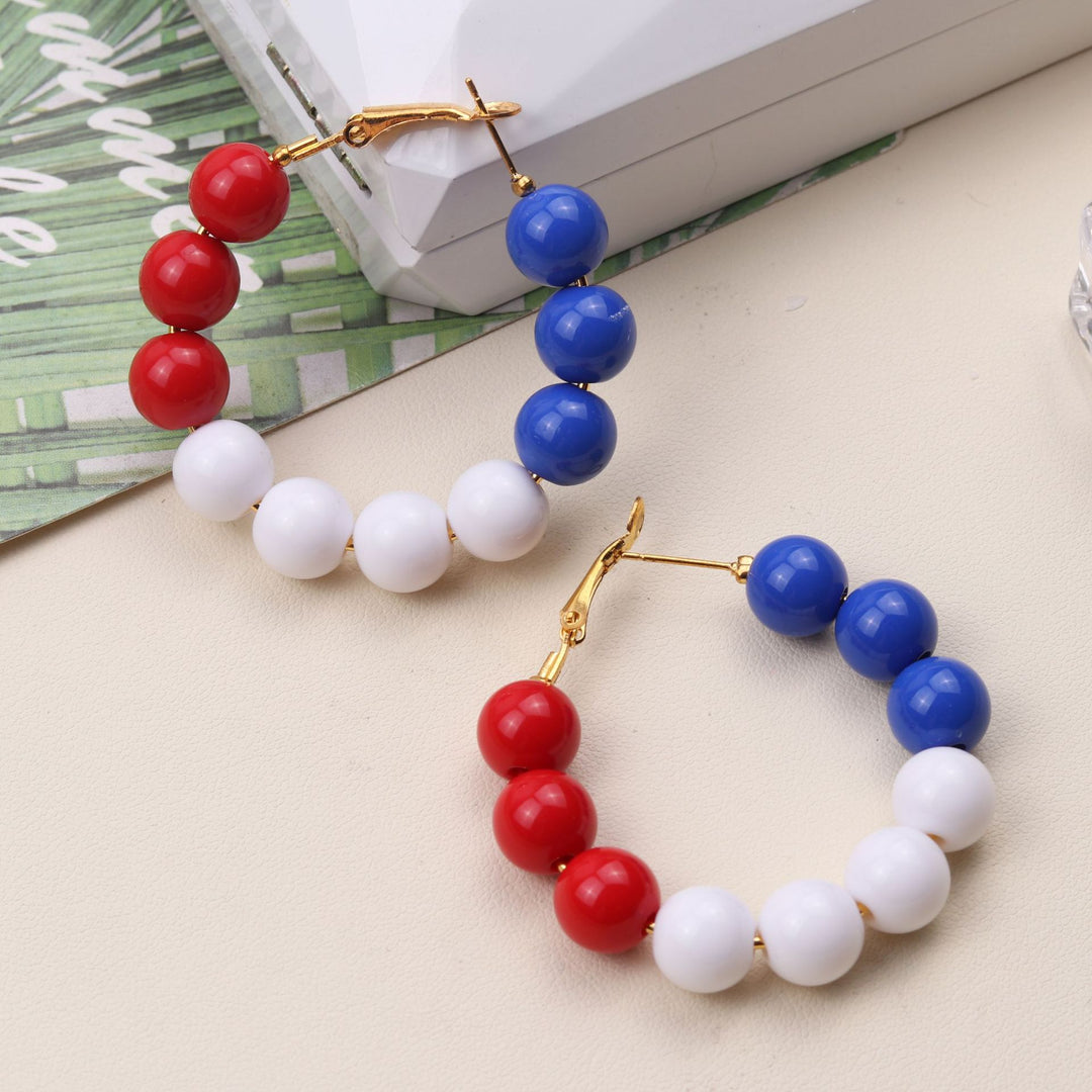 Women's pearl hoop earrings with large acrylic balls and secure clasp closure Bowlift