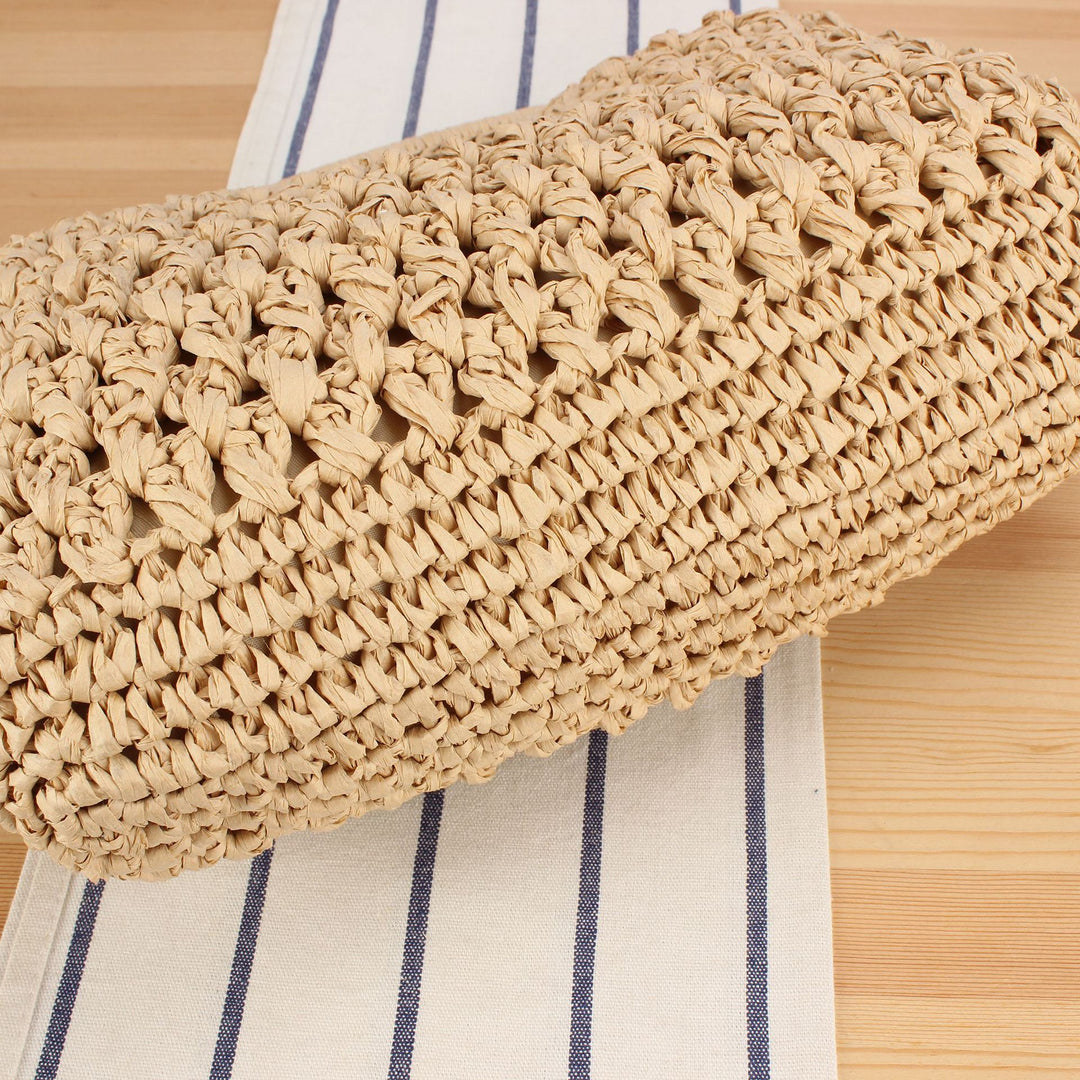 Handbag made of naturally untreated woven material with elegant chain embellishment Bowlift