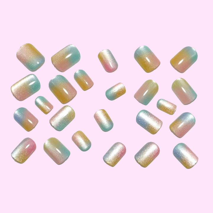 Artificial nails in delicate ombre design with glitter effects Bowlift