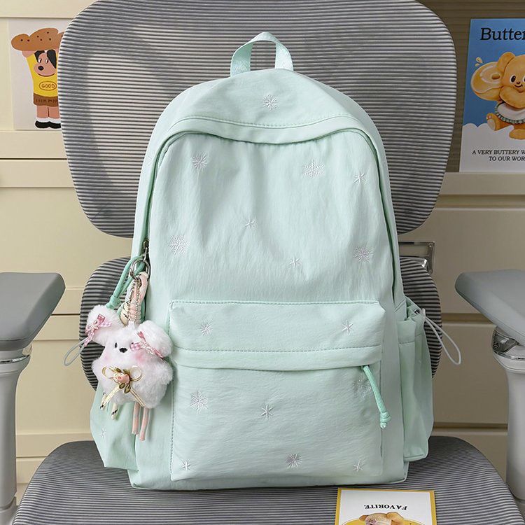Playful backpack with fine embroidery Bowlift