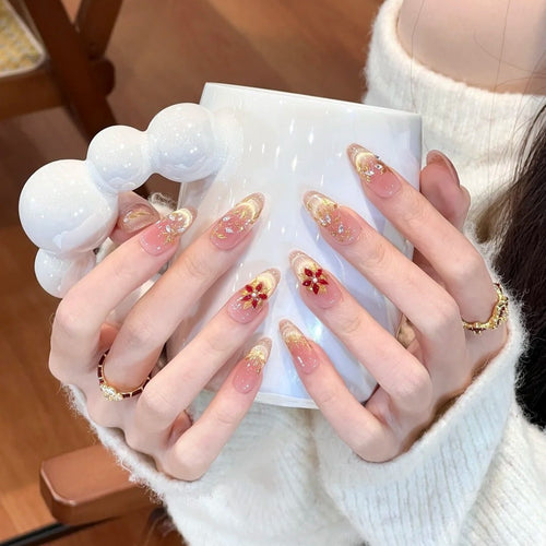 Artificial nails with elegant flower design and glitter accents Bowlift