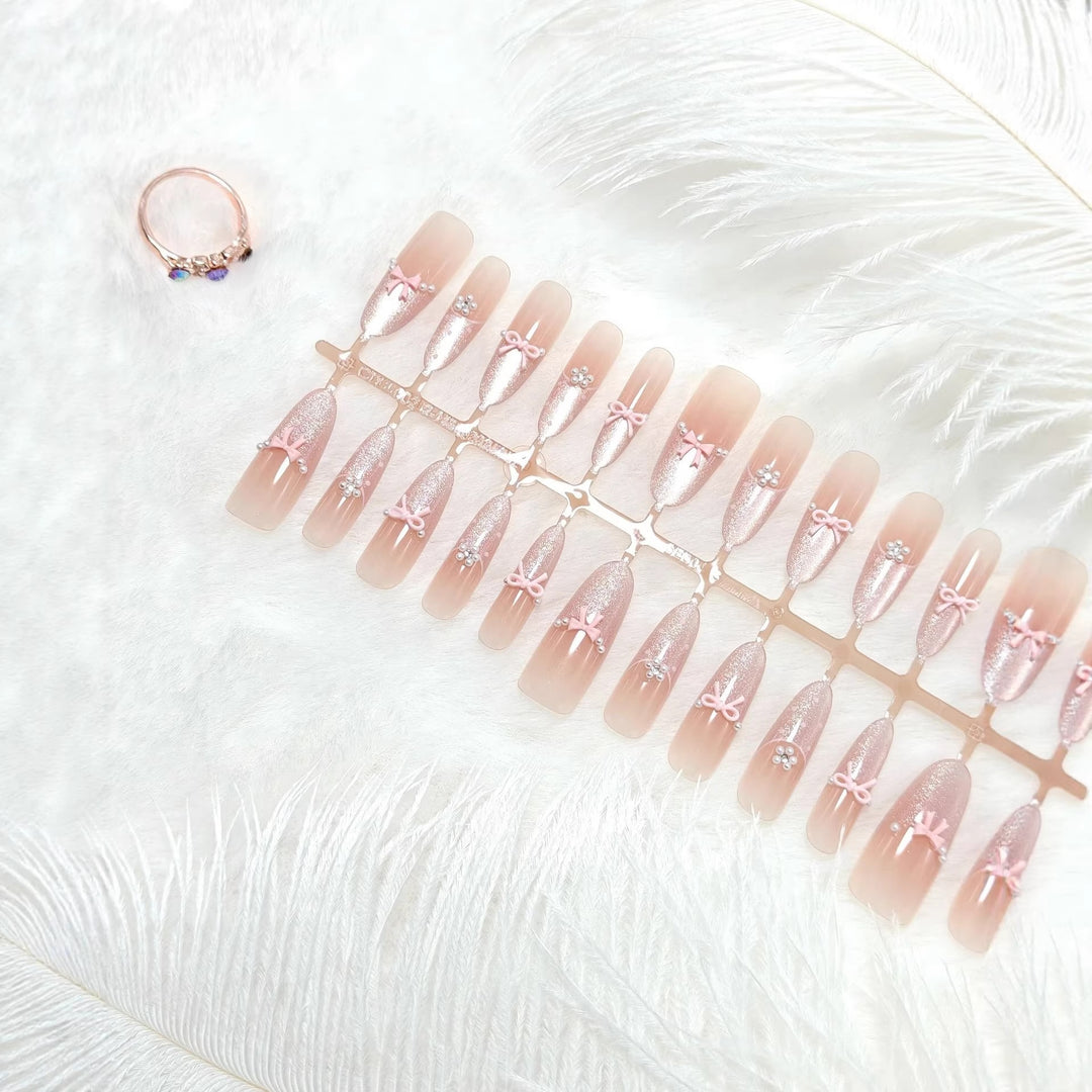 Artificial nails with elegant glitter and bow design Bowlift