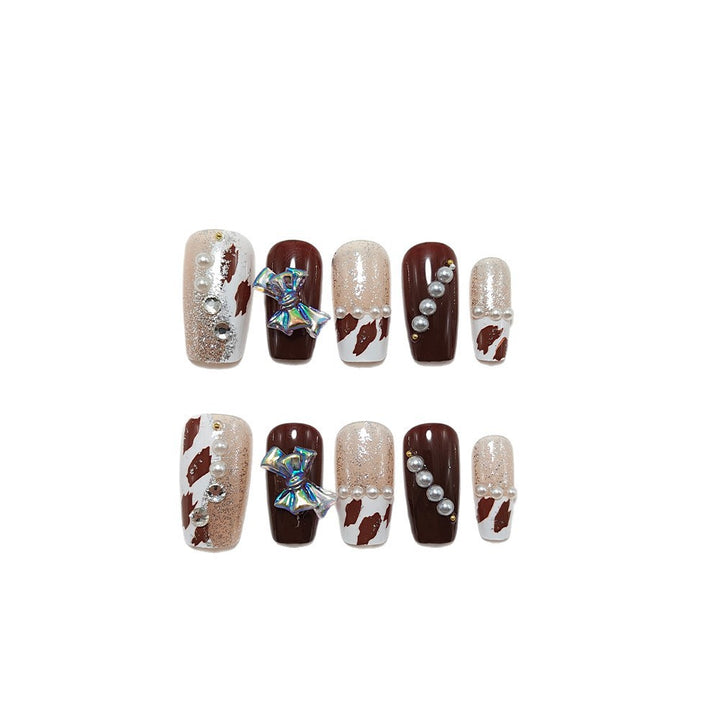 Artificial nails with glamorous 3D applications and glitter Bowlift