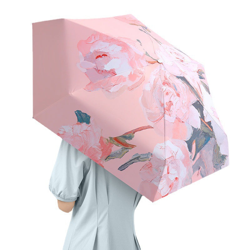 Women's folding umbrella with floral design and protective carrying pouch Bowlift