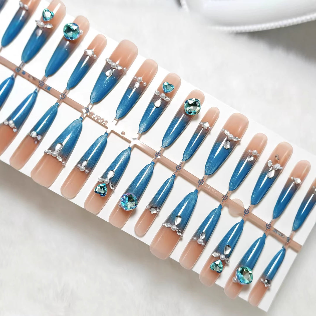 Artificial nails with elegant glitter and stone details Bowlift