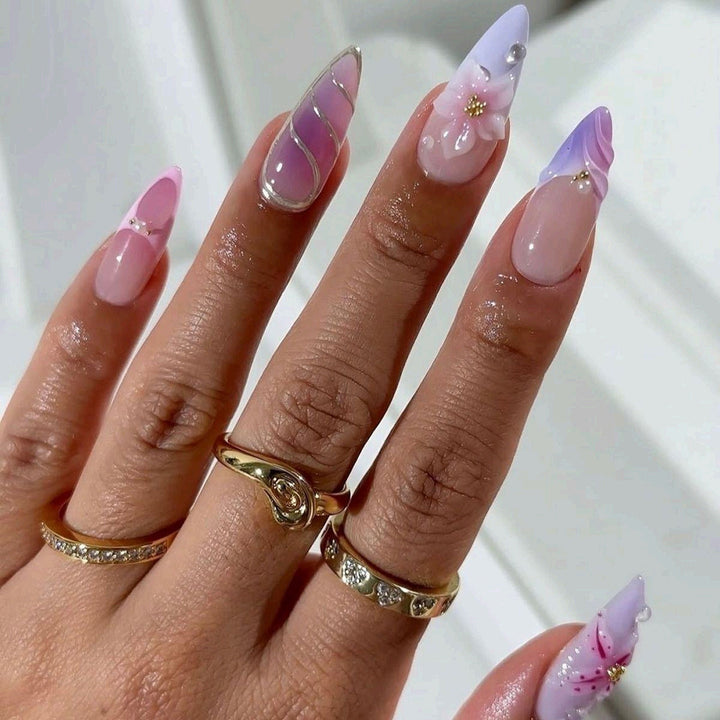 Artificial nails in elegant stiletto design with floral accent Bowlift