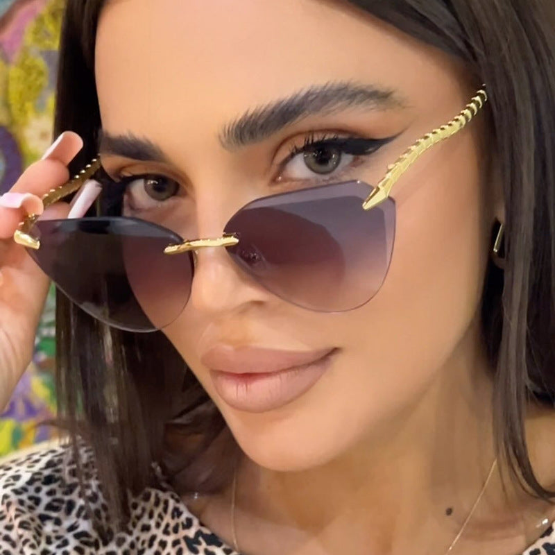 Women's Cat-Eye Sunglasses with unique gold frame design and protective lenses Bowlift
