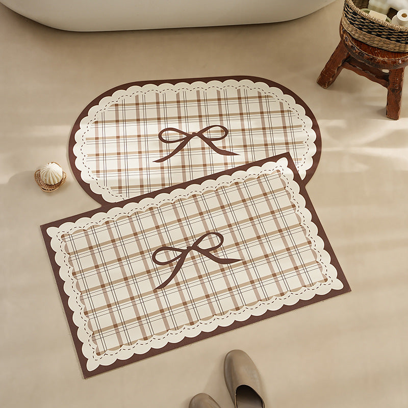 Rectangular wipeable placemat with checked pattern, wavy decorative edge and bow motif Bowlift