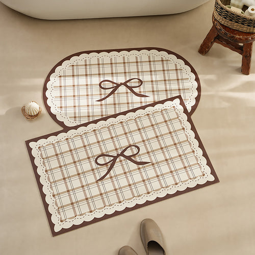 Rectangular wipeable placemat with checked pattern, wavy decorative edge and bow motif Bowlift