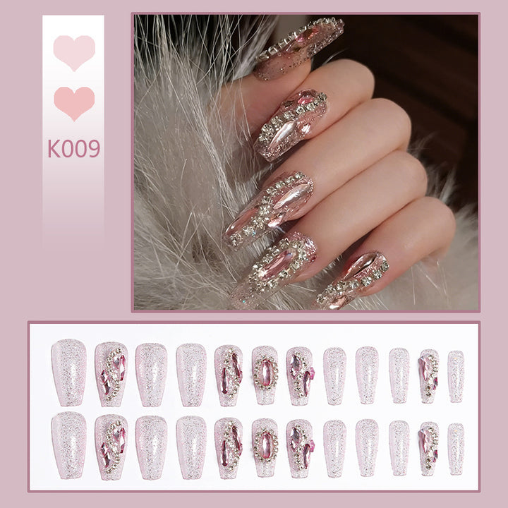 Glamorous artificial nails with sparkling rhinestone decorations Bowlift