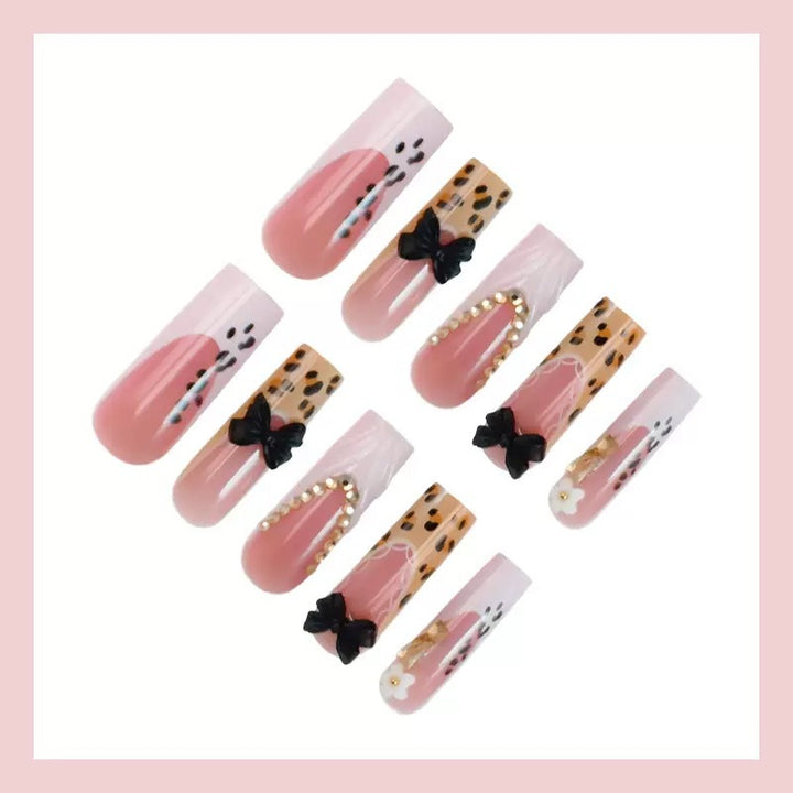 Artistic Press-On Nail Design with Bow and Animal Print Accents Bowlift