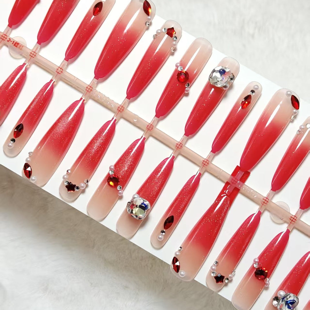 Artificial nails with glamorous glitter and rhinestone embellishments Bowlift