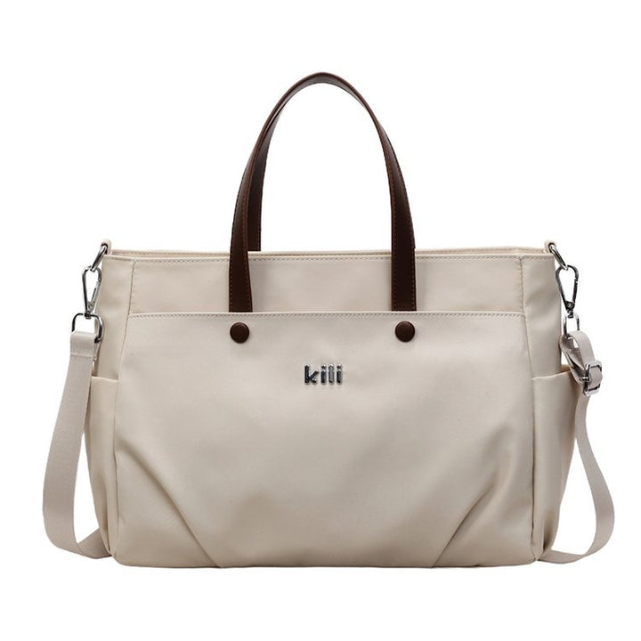 Shopping bag with comfortable carrying system and practical outer pockets Bowlift