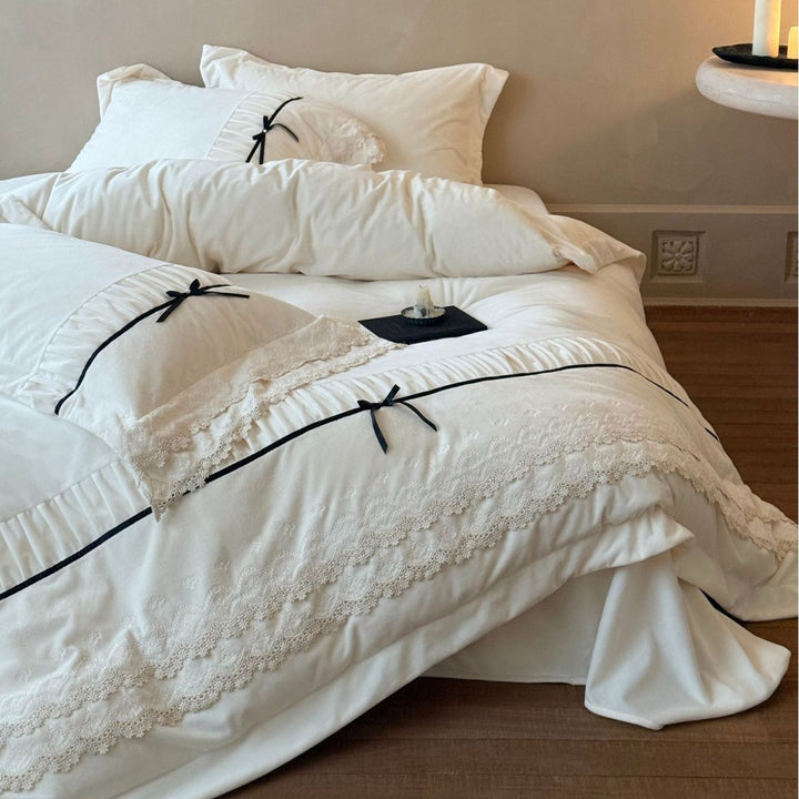 Romantic cotton satin bed linen set with ruffled hem, lace trim and decorative ribbons Bowlift