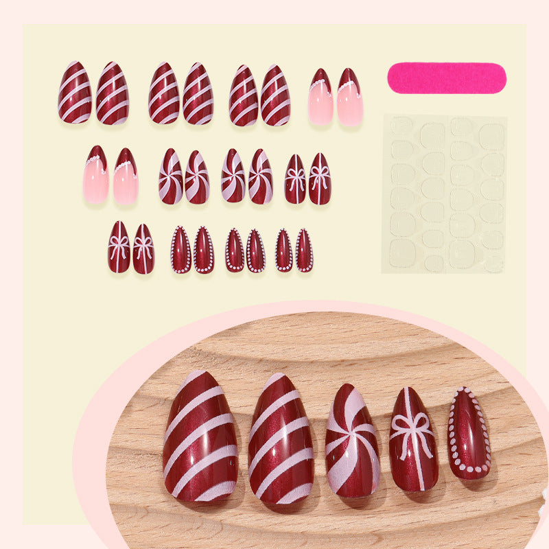 artfully designed nail set with festive candy cane motifs Bowlift