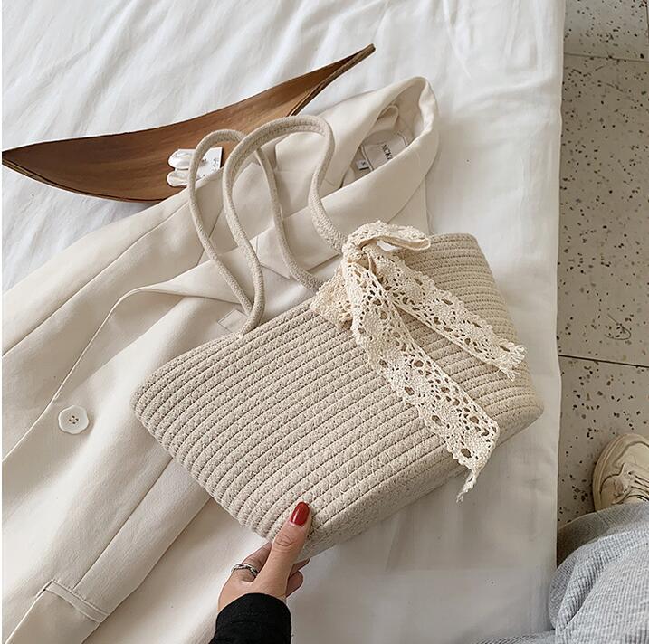 Elegant Bast Handbag with Lace Accent Bowlift