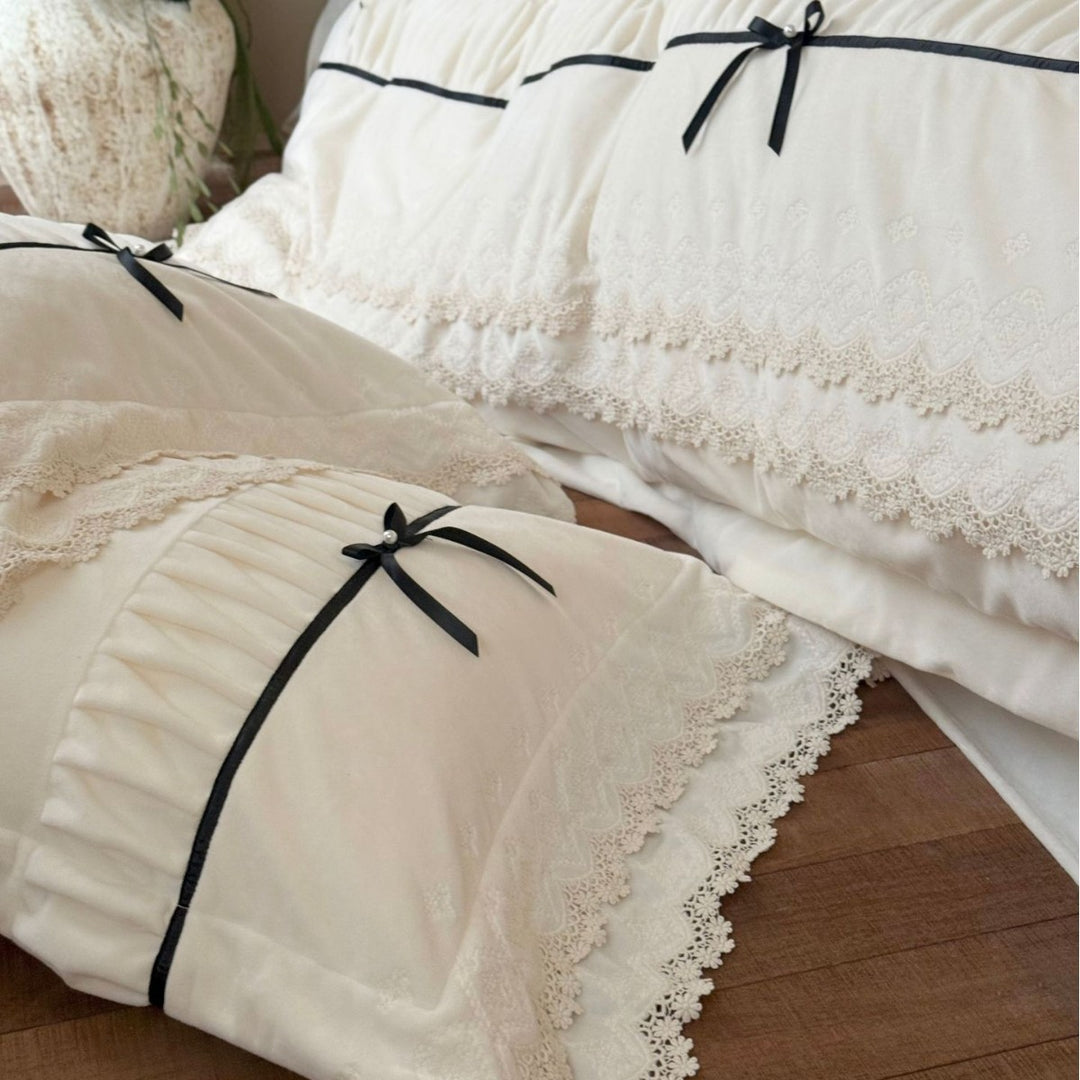Romantic cotton satin bed linen set with ruffled hem, lace trim and decorative ribbons Bowlift