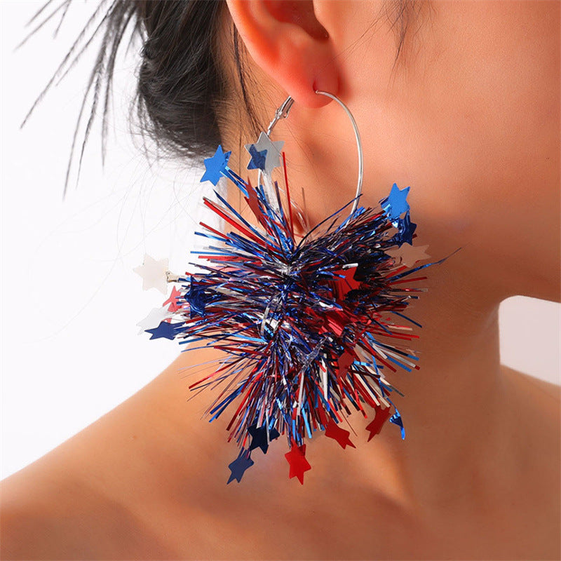 Women with eye-catching pompom hoops with lametta tassels and lightweight wire closure Bowlift