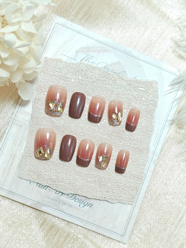 Acrylic nails in elegant ombre design with glitter elements Bowlift